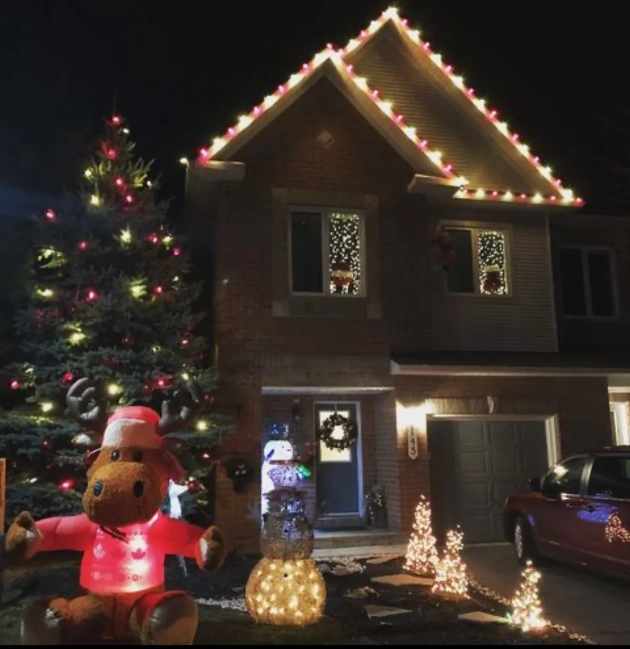 Colourful roofline lights on a home