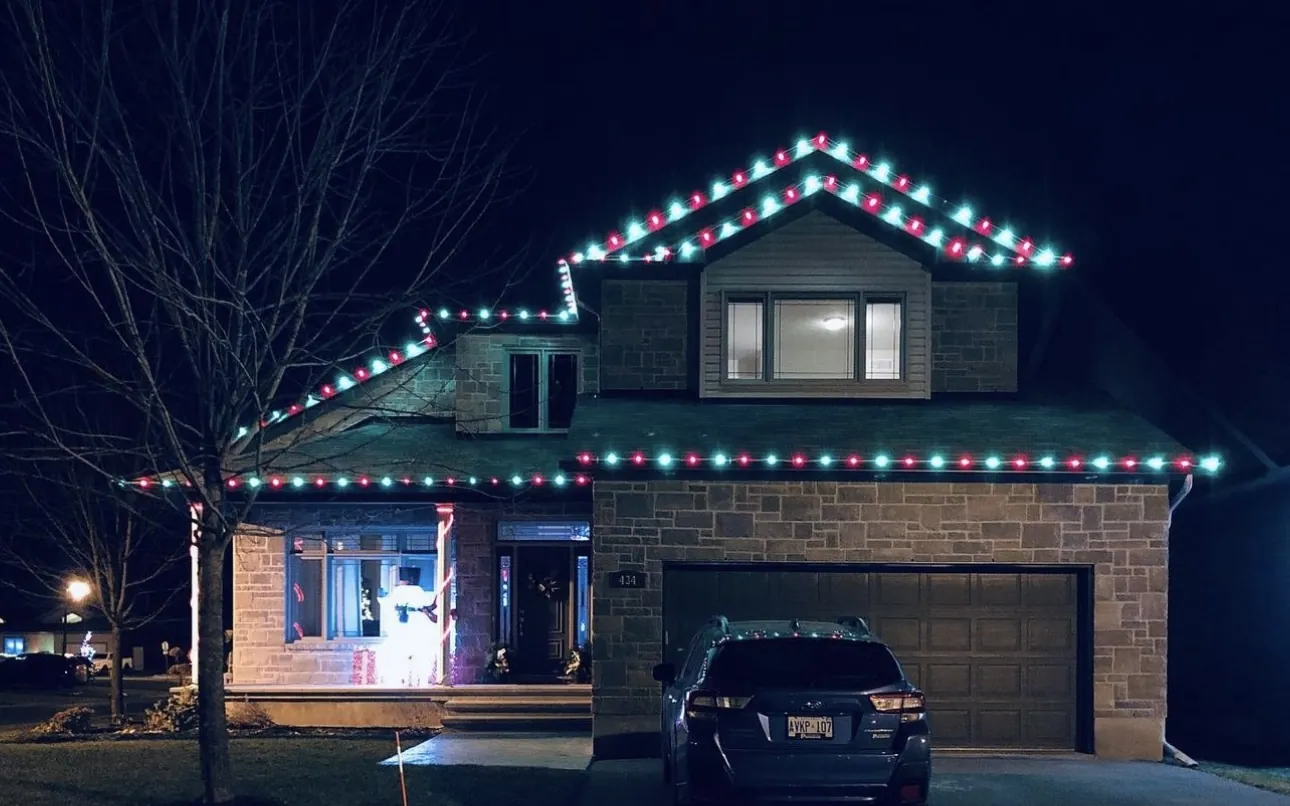 Home with red and green holiday lighting